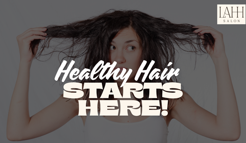 Woman holding up her frizzy, damaged hair