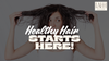 Woman holding up her frizzy, damaged hair