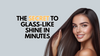 Smiling woman with sleek, shiny long hair holding a section near her face, next to bold text that reads “The Secret to Glass-Like Shine in Minutes.”