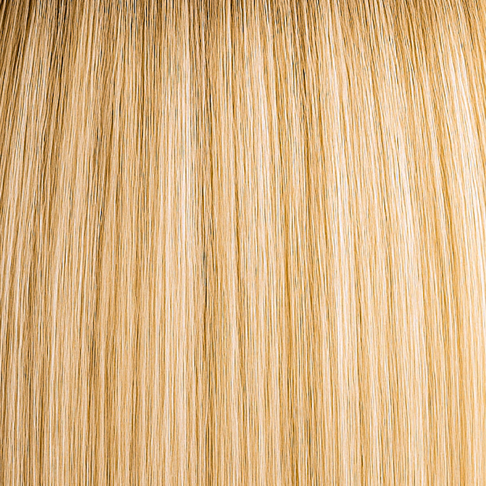 Rooted blonde hair extension with warm vanilla tones, dimensional and natural-looking.