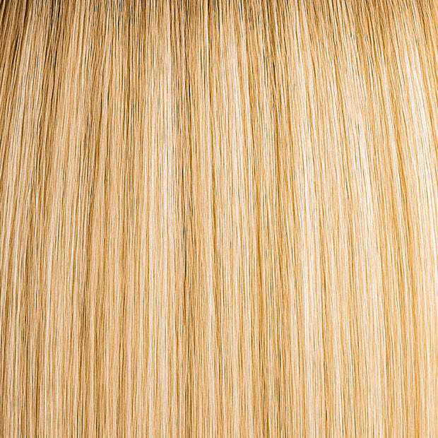 Rooted blonde hair extension with warm vanilla tones, dimensional and natural-looking.