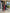 Two people cutting a red ribbon outside Lahh Salon Miami